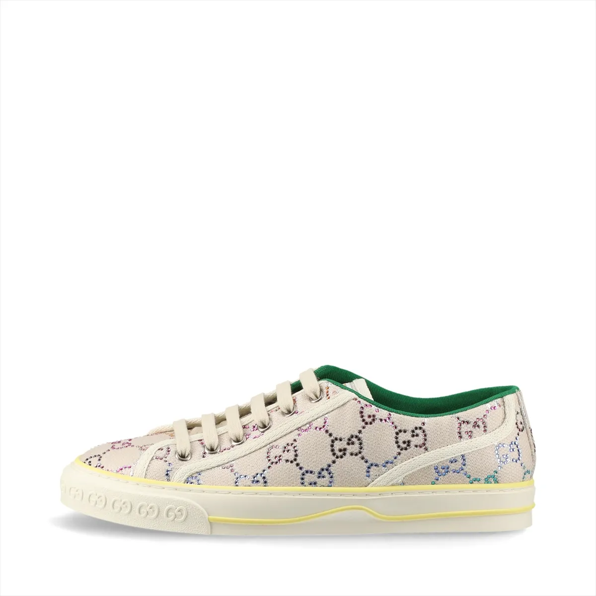 Ivory canvas low-top sneaker with woven stripe and sparkling stones along the heel.
