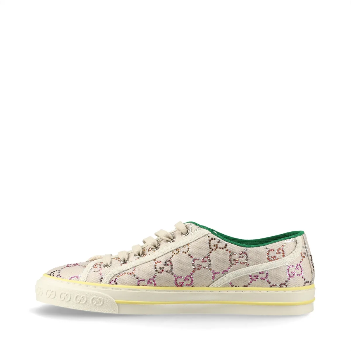 Ivory canvas low-top sneaker with woven stripe and sparkling stones along the heel.