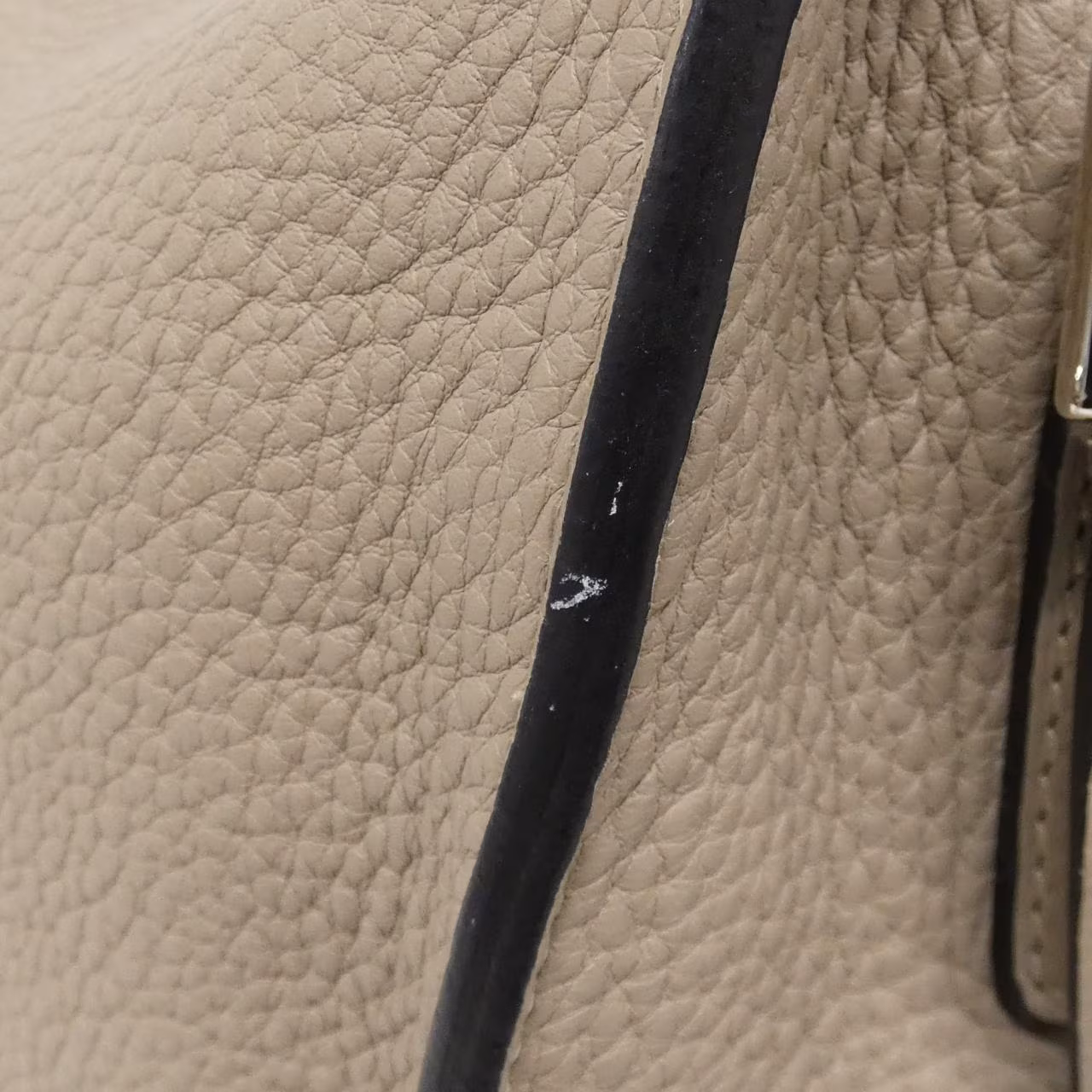 Shoulder bag with a long strap shown upright against a plain background.