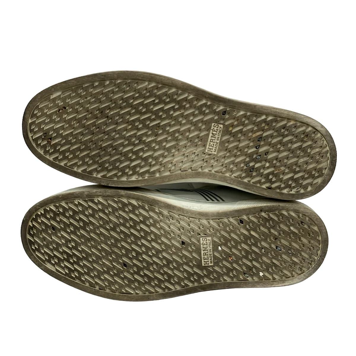 Low-profile lace-up shoe shown from the side on a plain background.