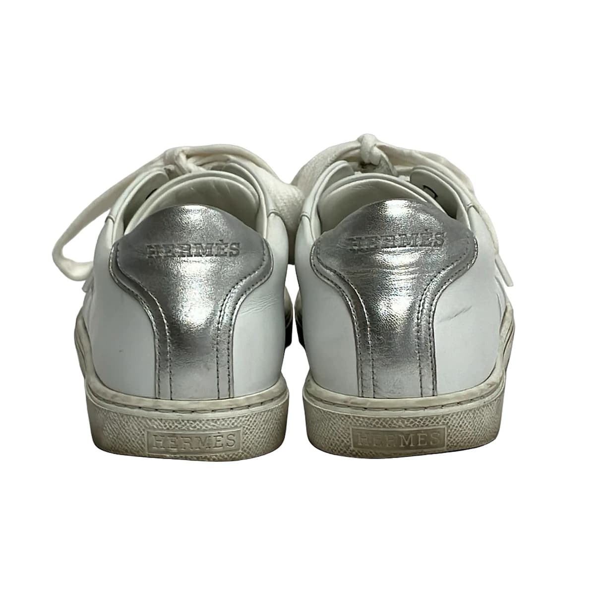 Low-profile lace-up shoe shown from the side on a plain background.