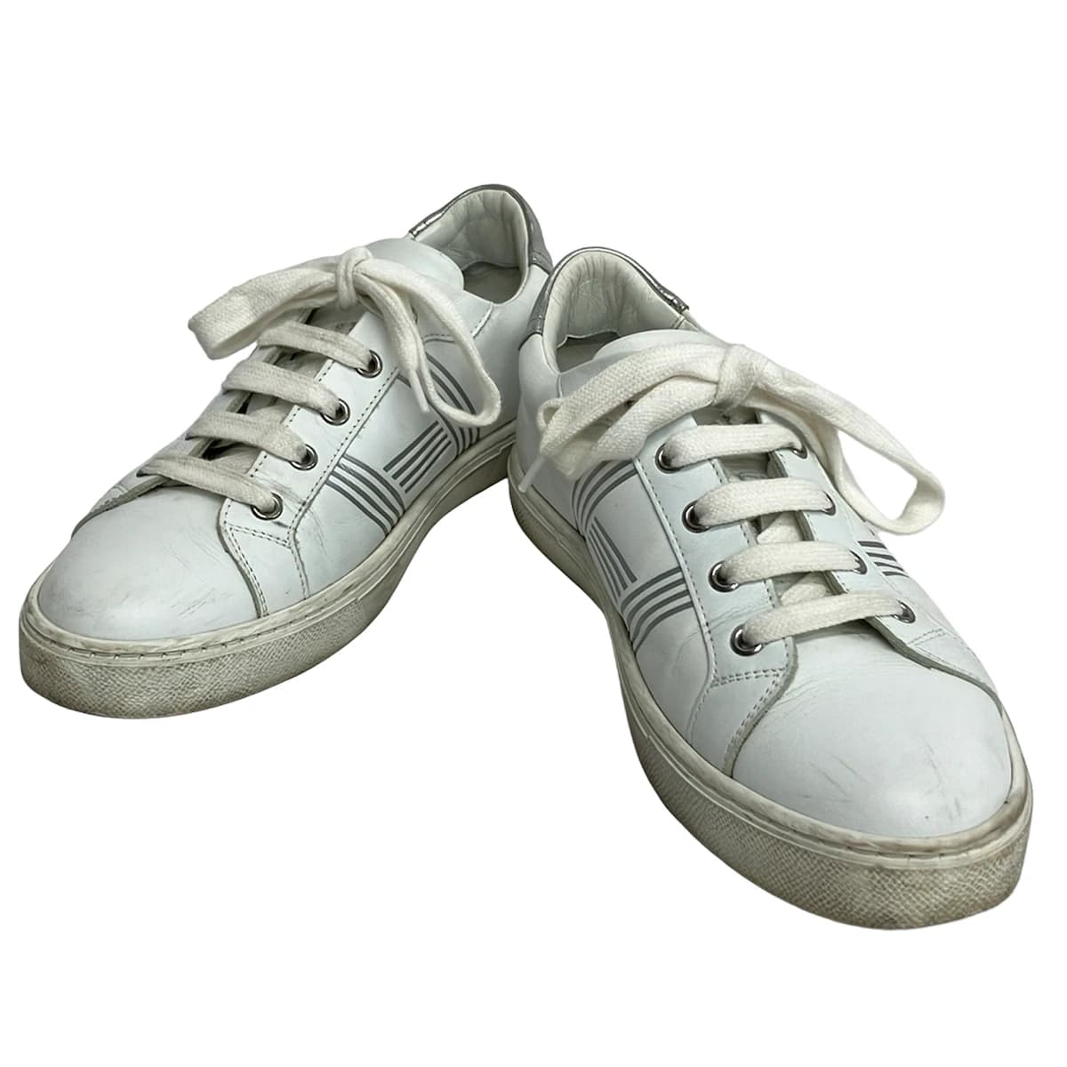 Low-profile lace-up shoe shown from the side on a plain background.