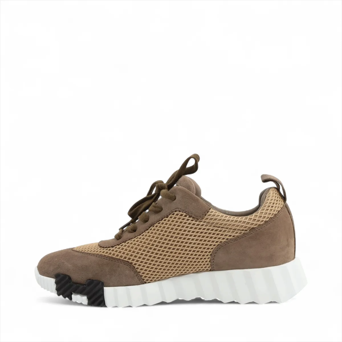Brown suede and fabric low-top sneaker with mesh side panels and a white sole.