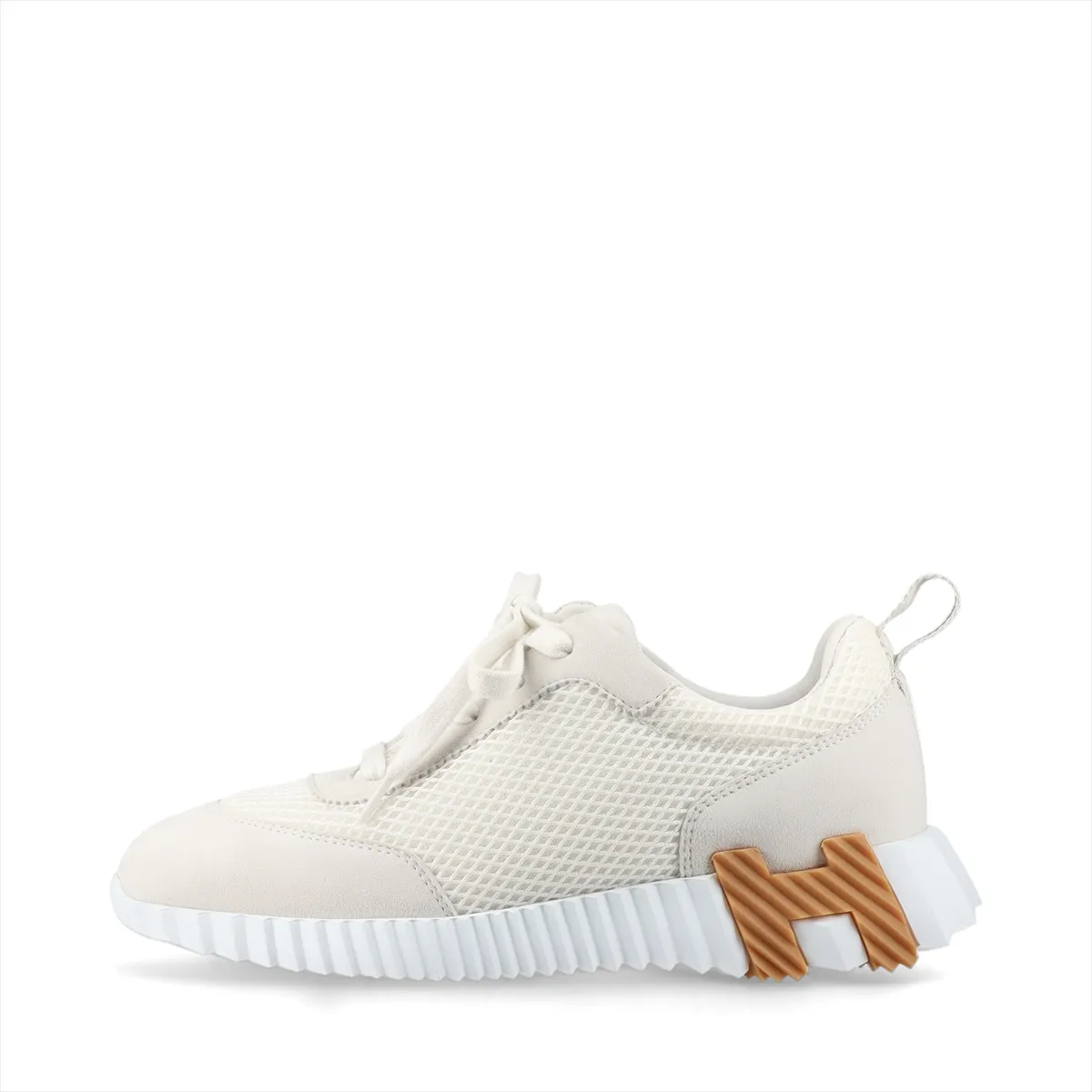Product photograph of a pair of grey and ivory low-top shoes with mesh panels.