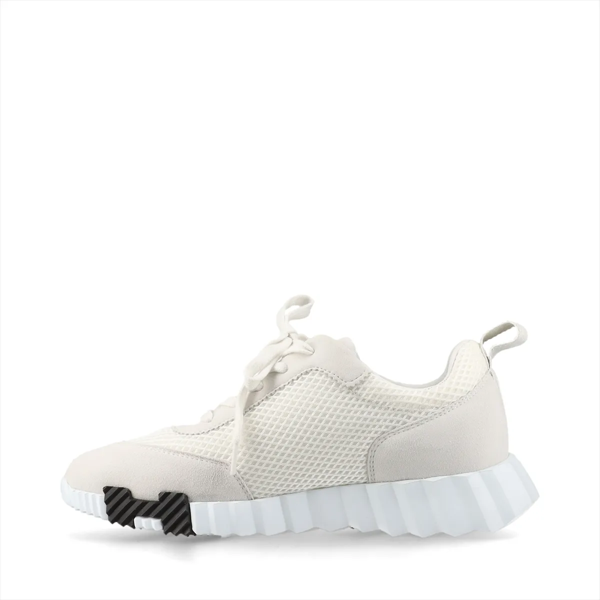 Product photograph of a pair of grey and ivory low-top shoes with mesh panels.