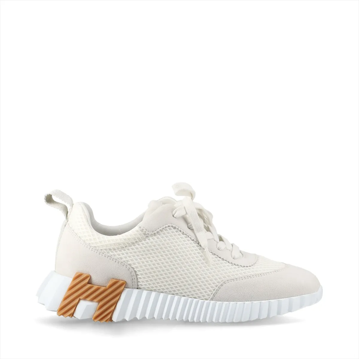 Product photograph of a pair of grey and ivory low-top shoes with mesh panels.