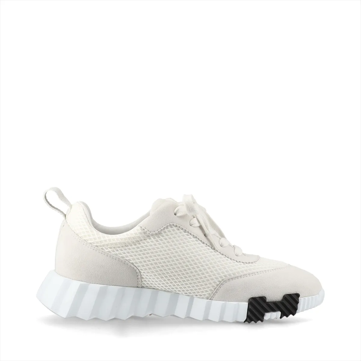 Product photograph of a pair of grey and ivory low-top shoes with mesh panels.