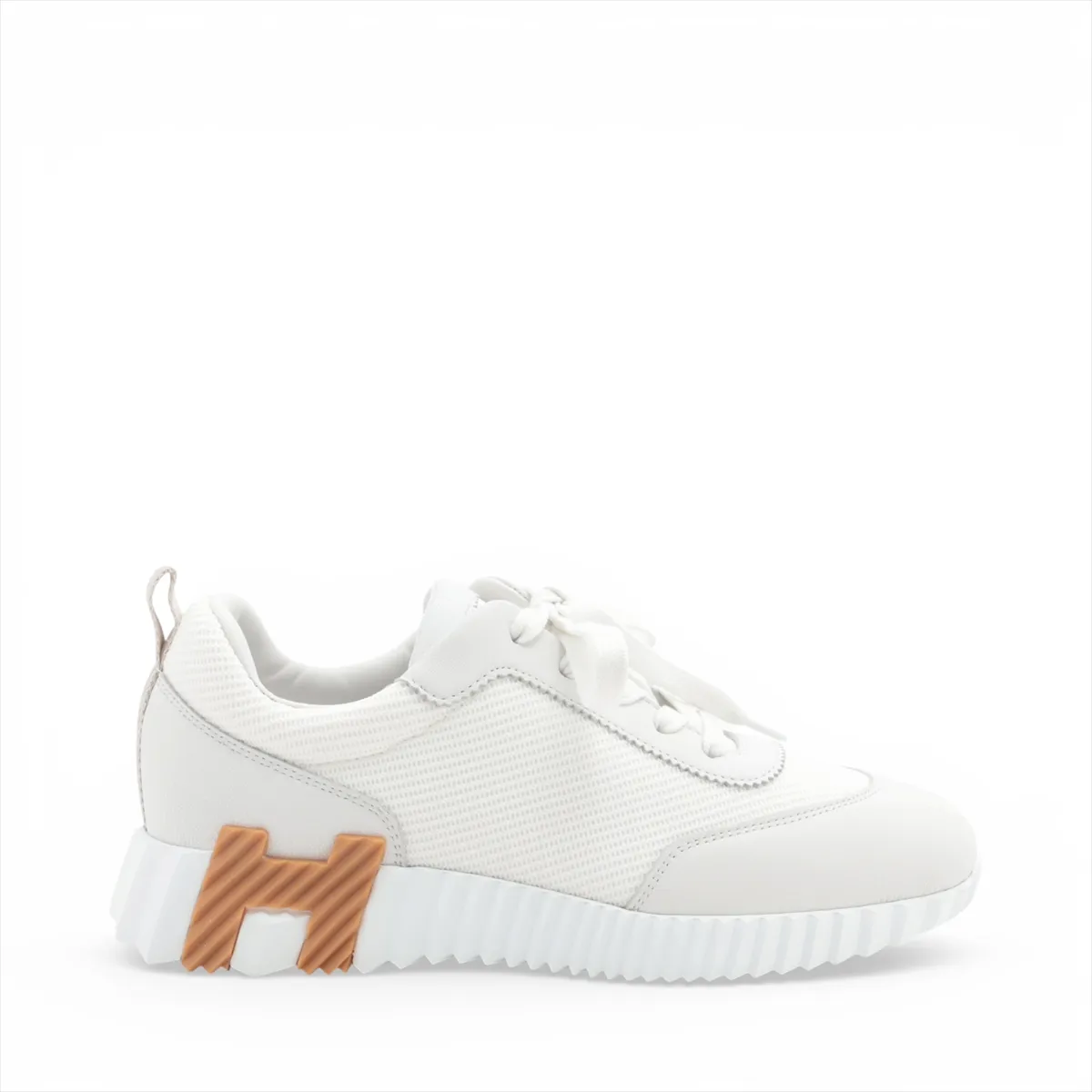 Light grey and white running-style sneakers with mesh panels and a thick white sole.