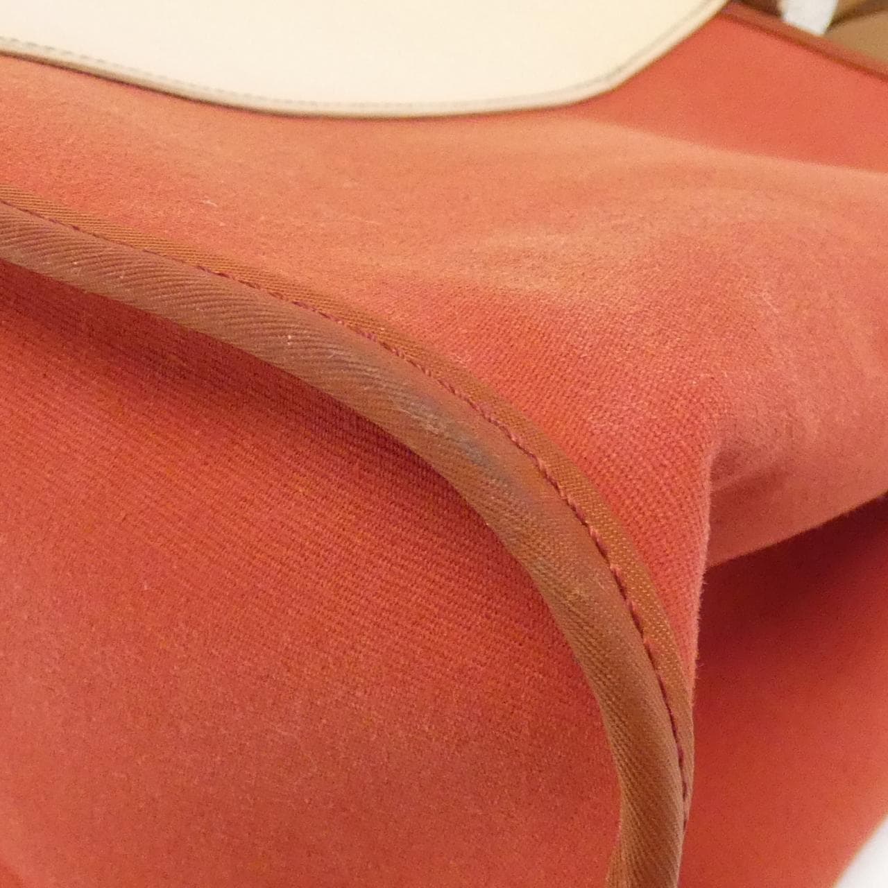 Canvas and leather bag shown upright against a plain background.