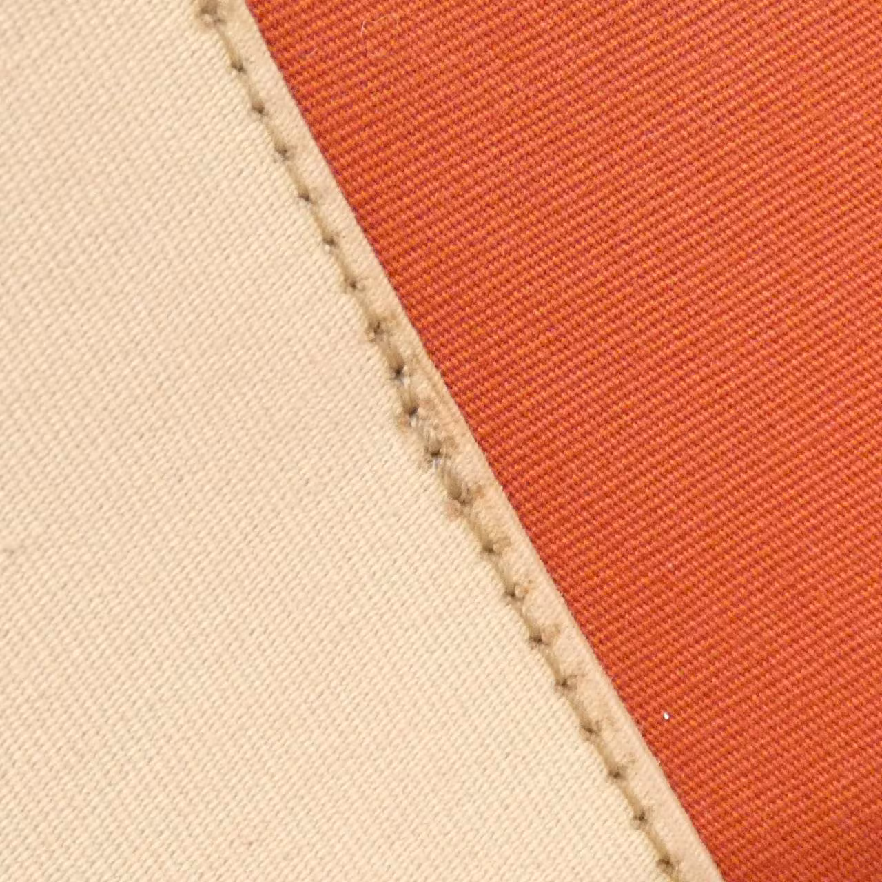 Canvas and leather bag shown upright against a plain background.