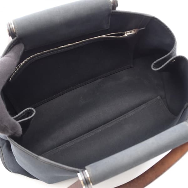 Black canvas tote bag with leather-trimmed handles and a detachable strap.