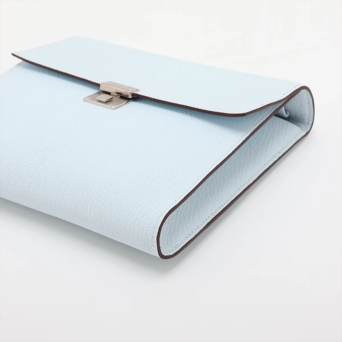 Blue grained leather piece with silver-tone metal fittings.