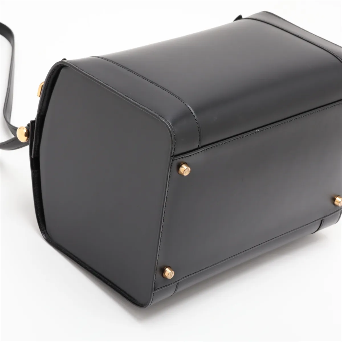 Black smooth leather bag with gold-tone fittings and a shoulder strap.