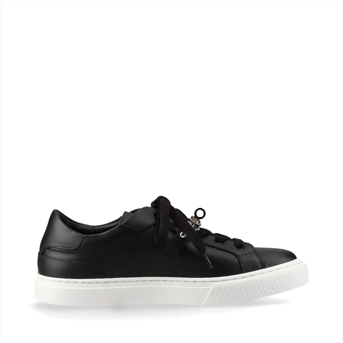 Black leather sneakers with metal buckle hardware and studded detailing