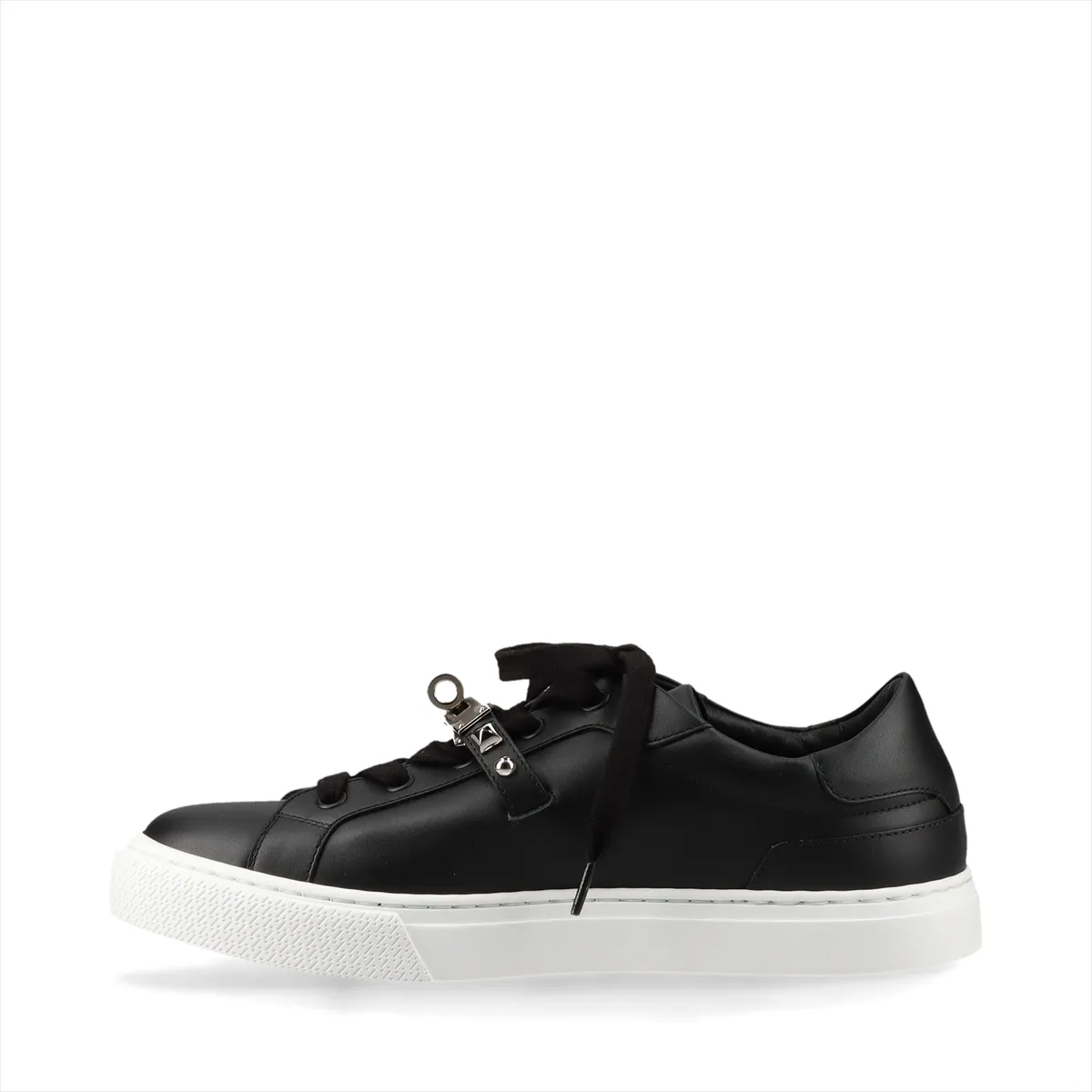 Black leather sneakers with metal buckle hardware and studded detailing