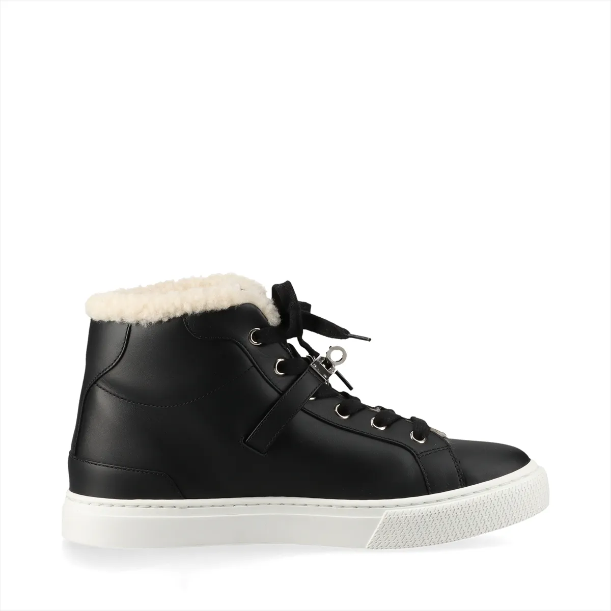 Black high-top sneakers with fluffy shearling lining and metal buckle hardware