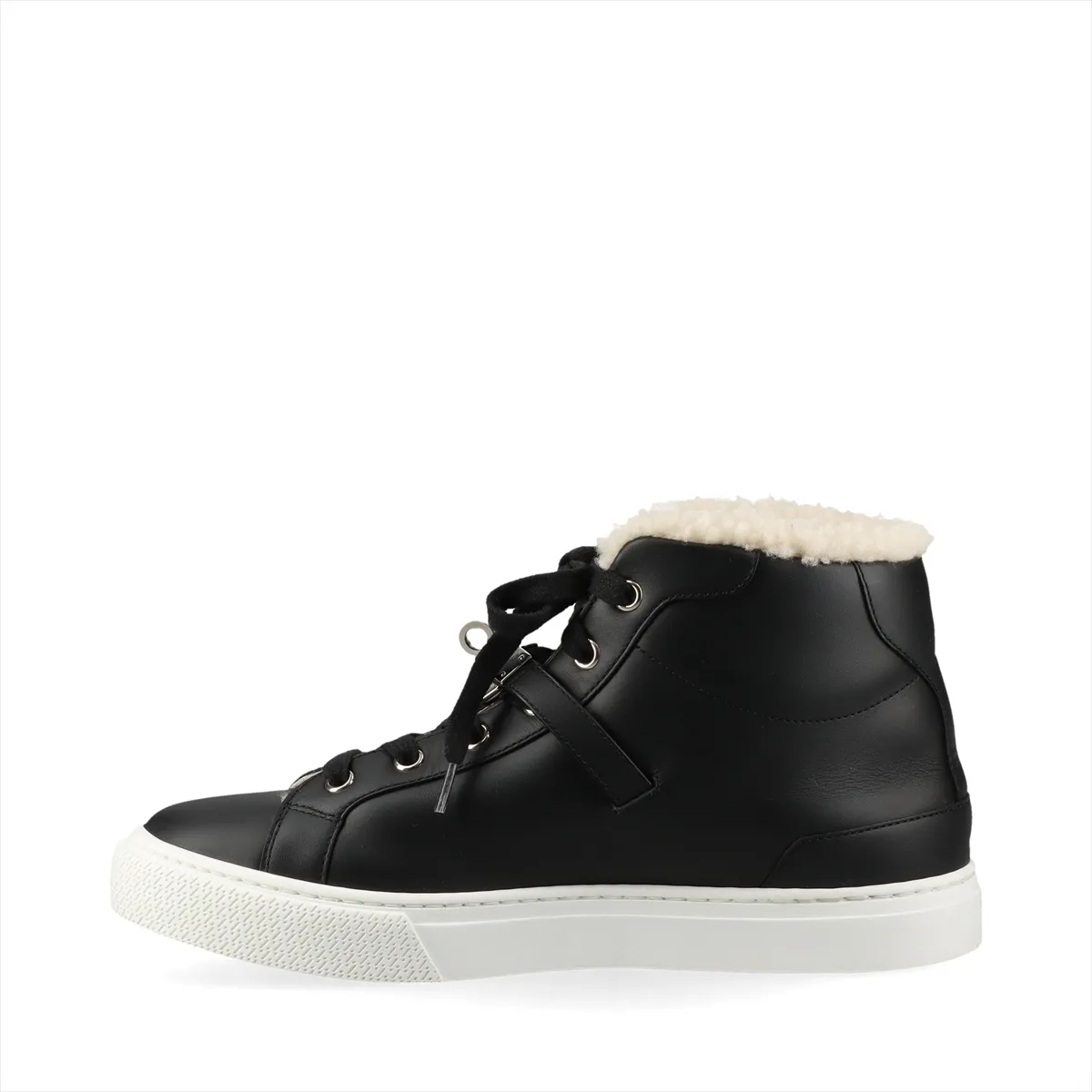 Black high-top sneakers with fluffy shearling lining and metal buckle hardware