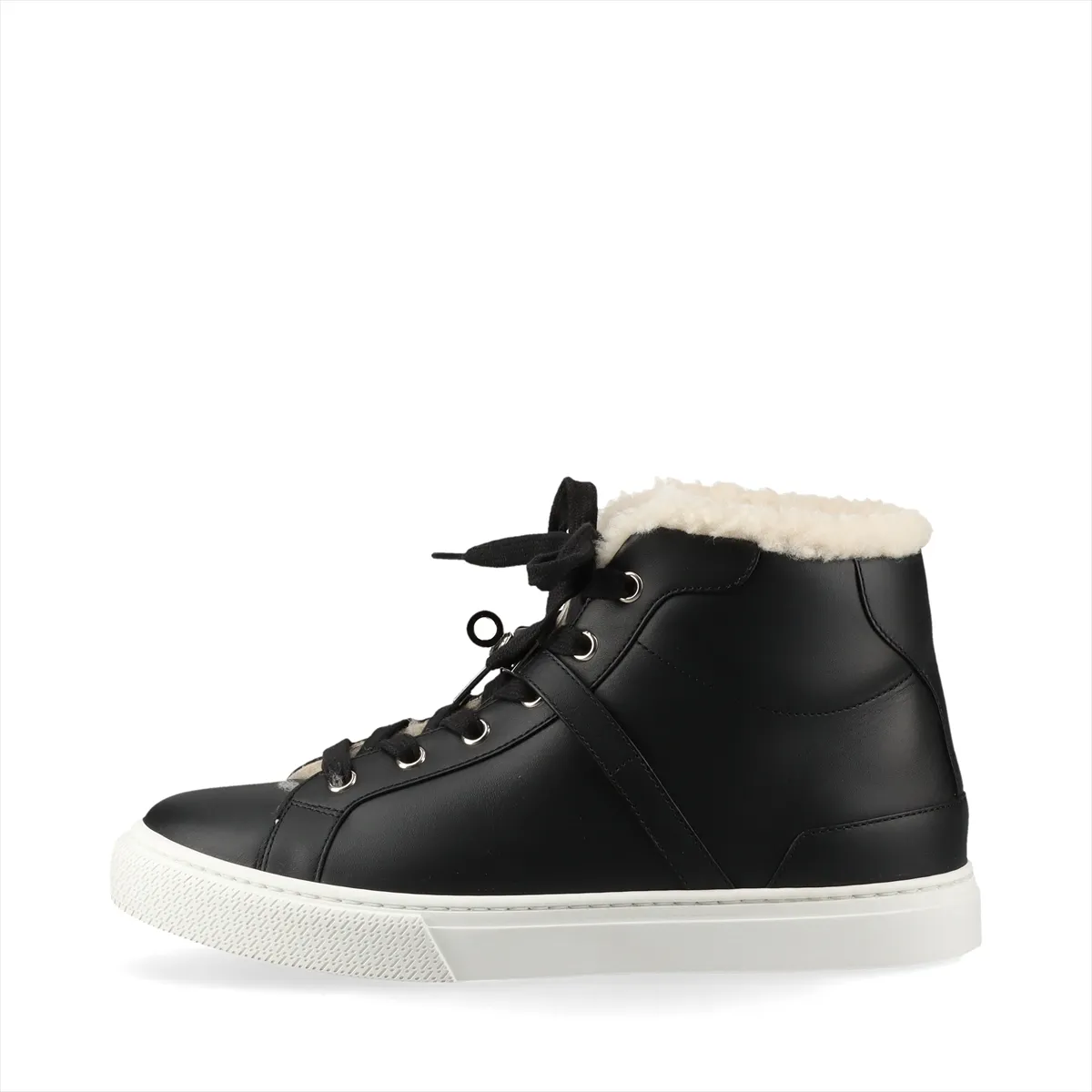 Black high-top sneakers with fluffy shearling lining and metal buckle hardware