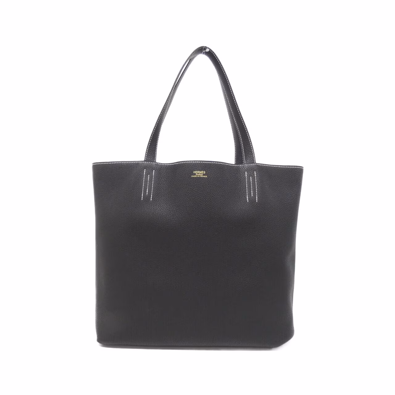 Large reversible open tote with twin handles against a plain background.