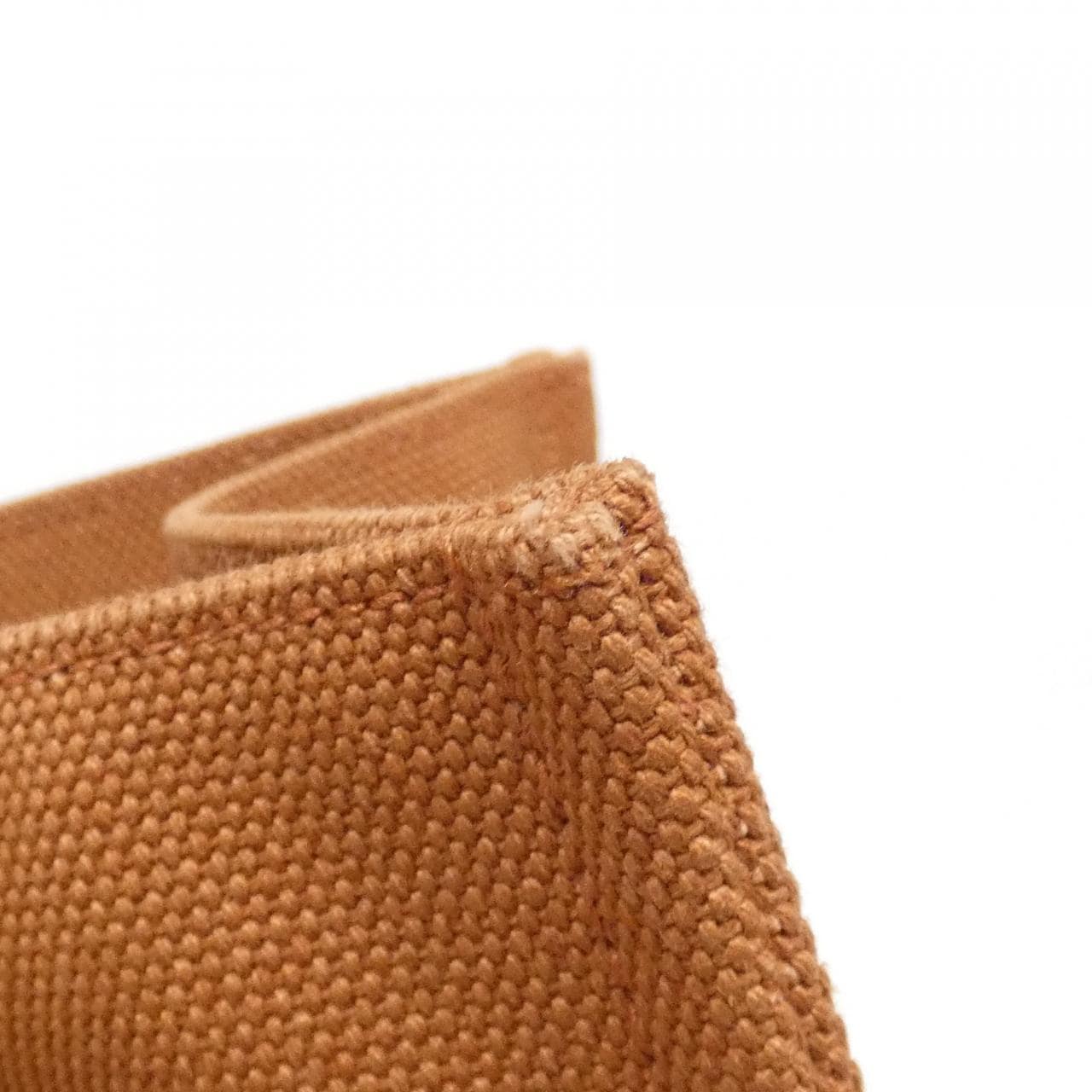 Open-top tote bag with twin handles shown against a plain background.