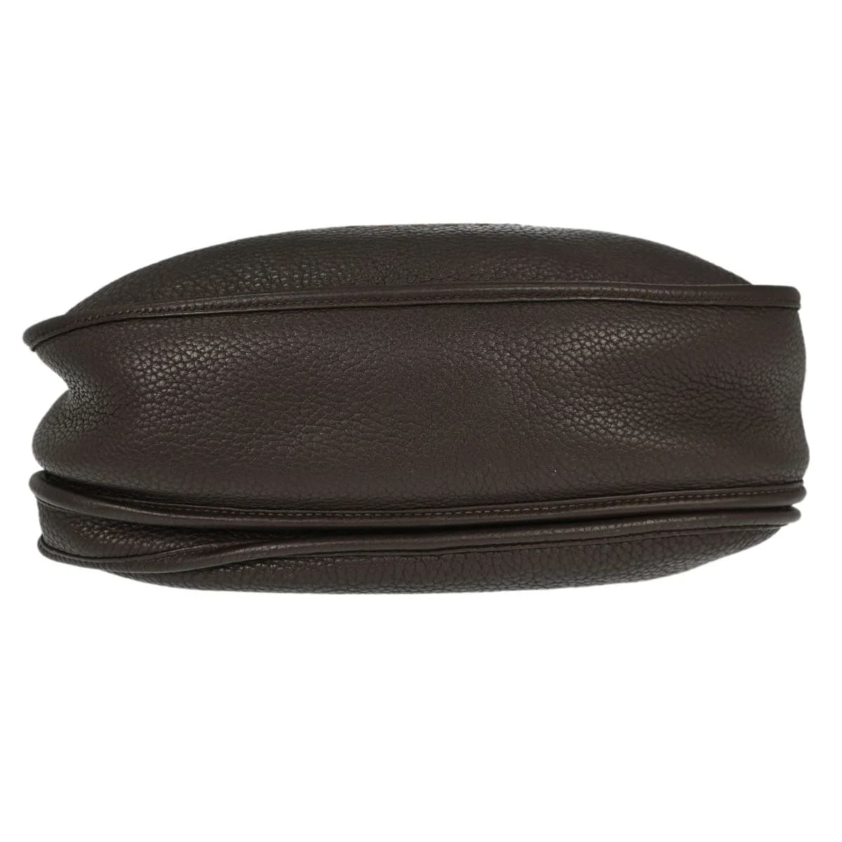 Brown leather shoulder bag with perforated logo front panel and long flat strap.