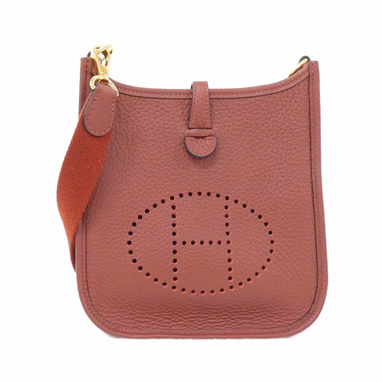 Small leather shoulder bag with perforated H on the front and woven strap.