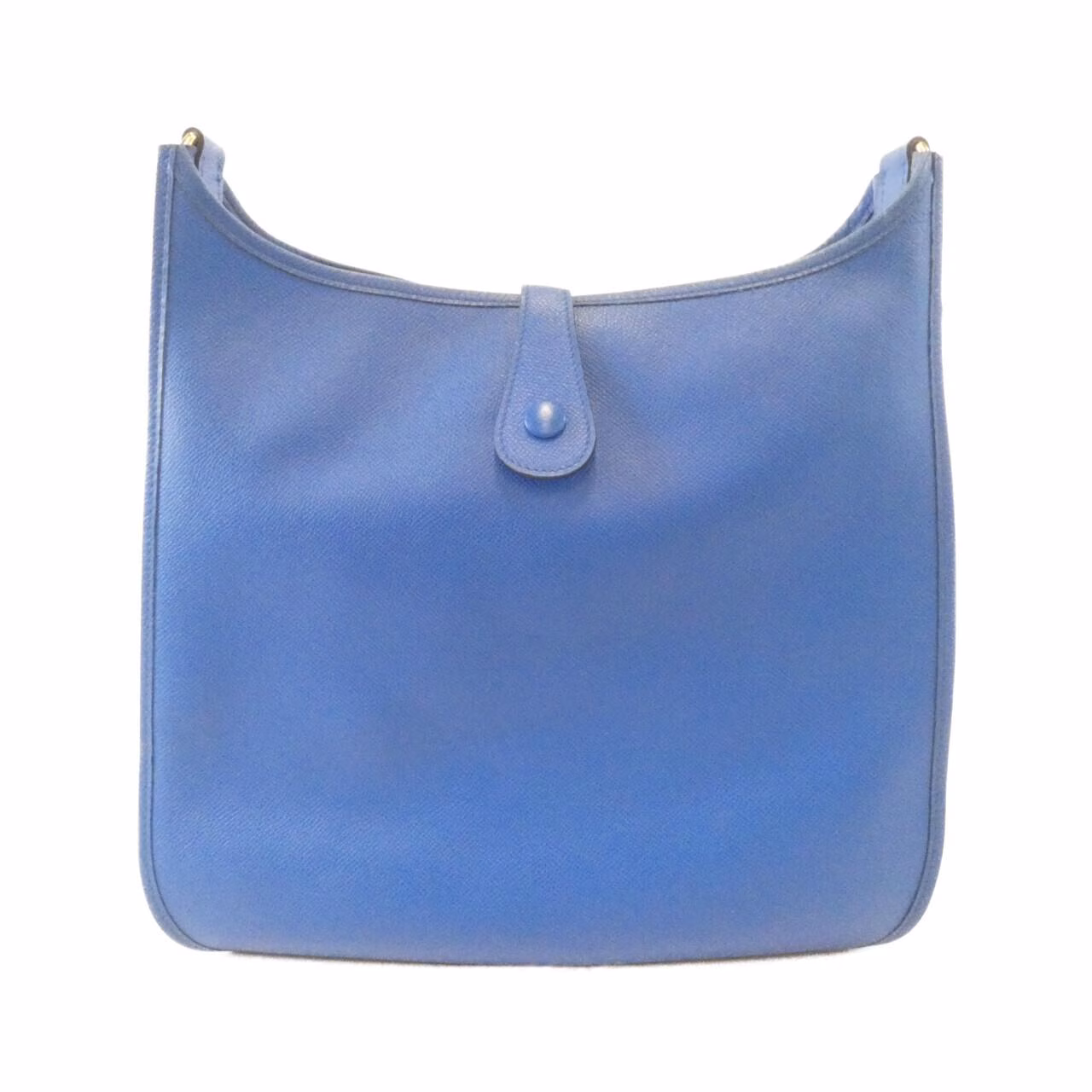 Leather shoulder bag with perforated H motif on the front and a long adjustable strap.