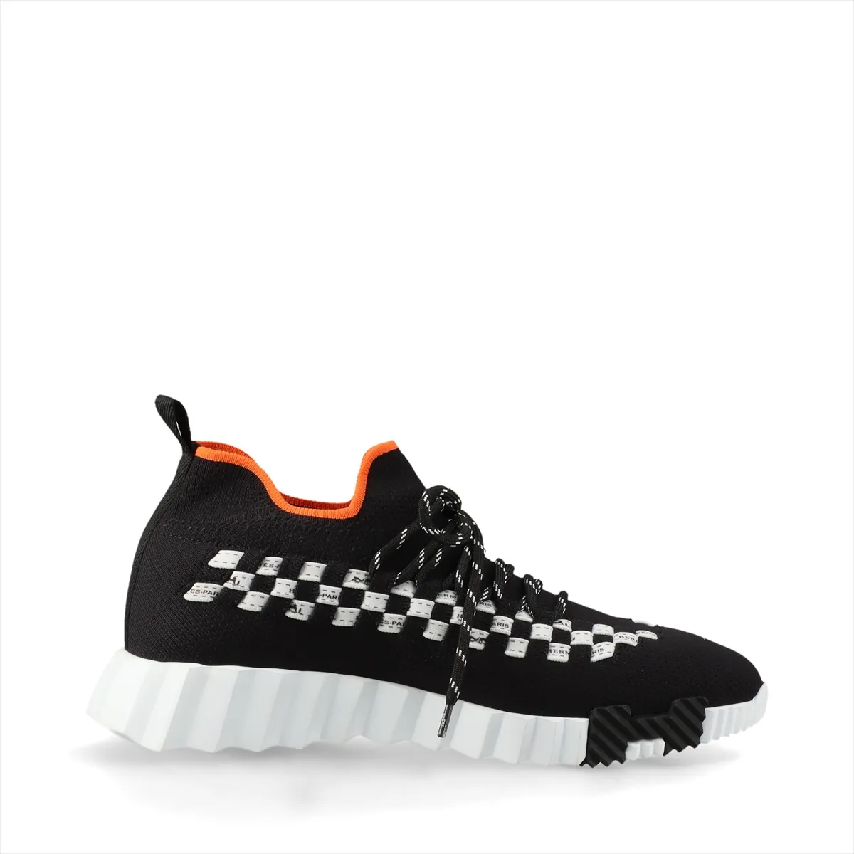 Black knit sneaker with white sole and white detailing at the heel.
