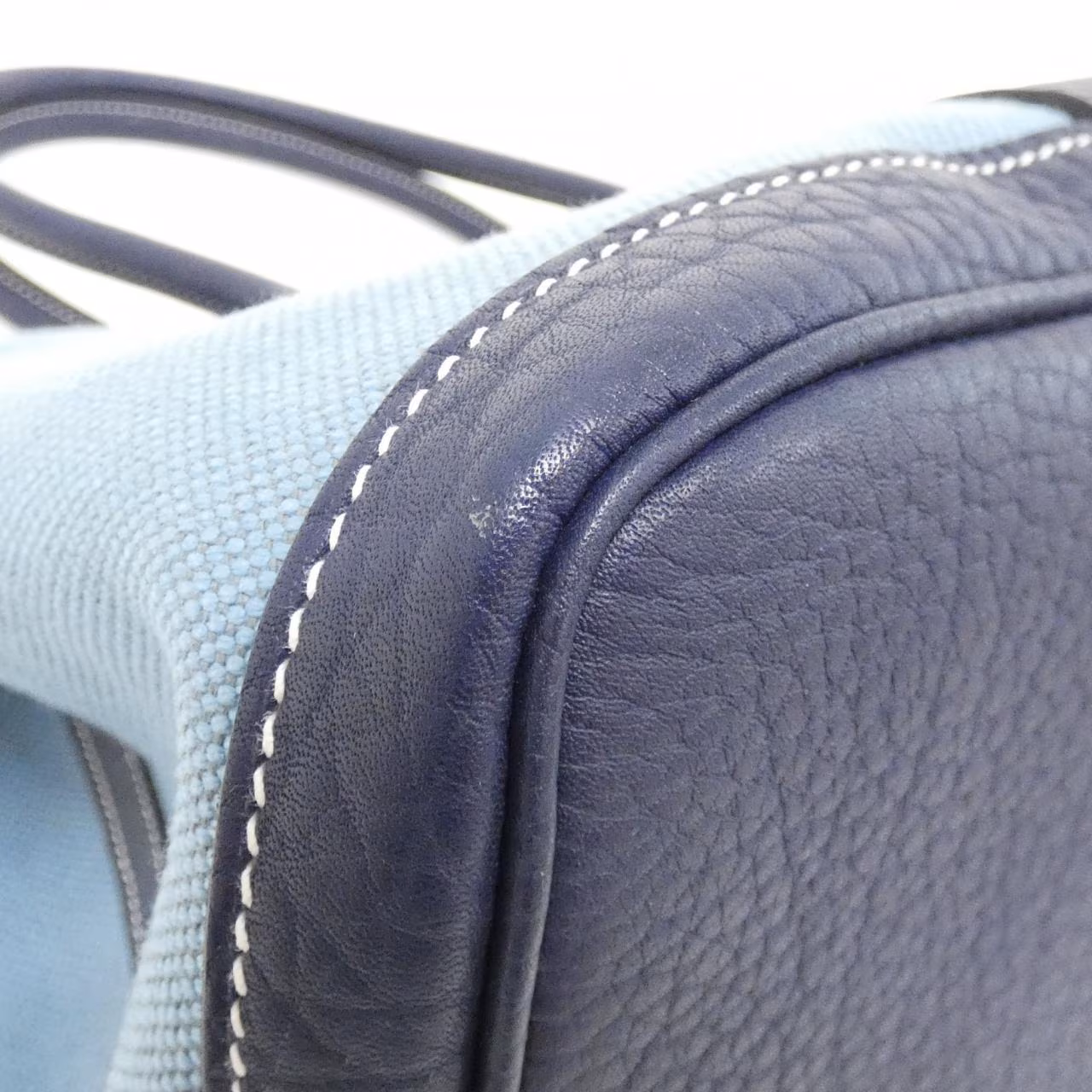 Open-top tote with twin rolled handles shown against a plain background.