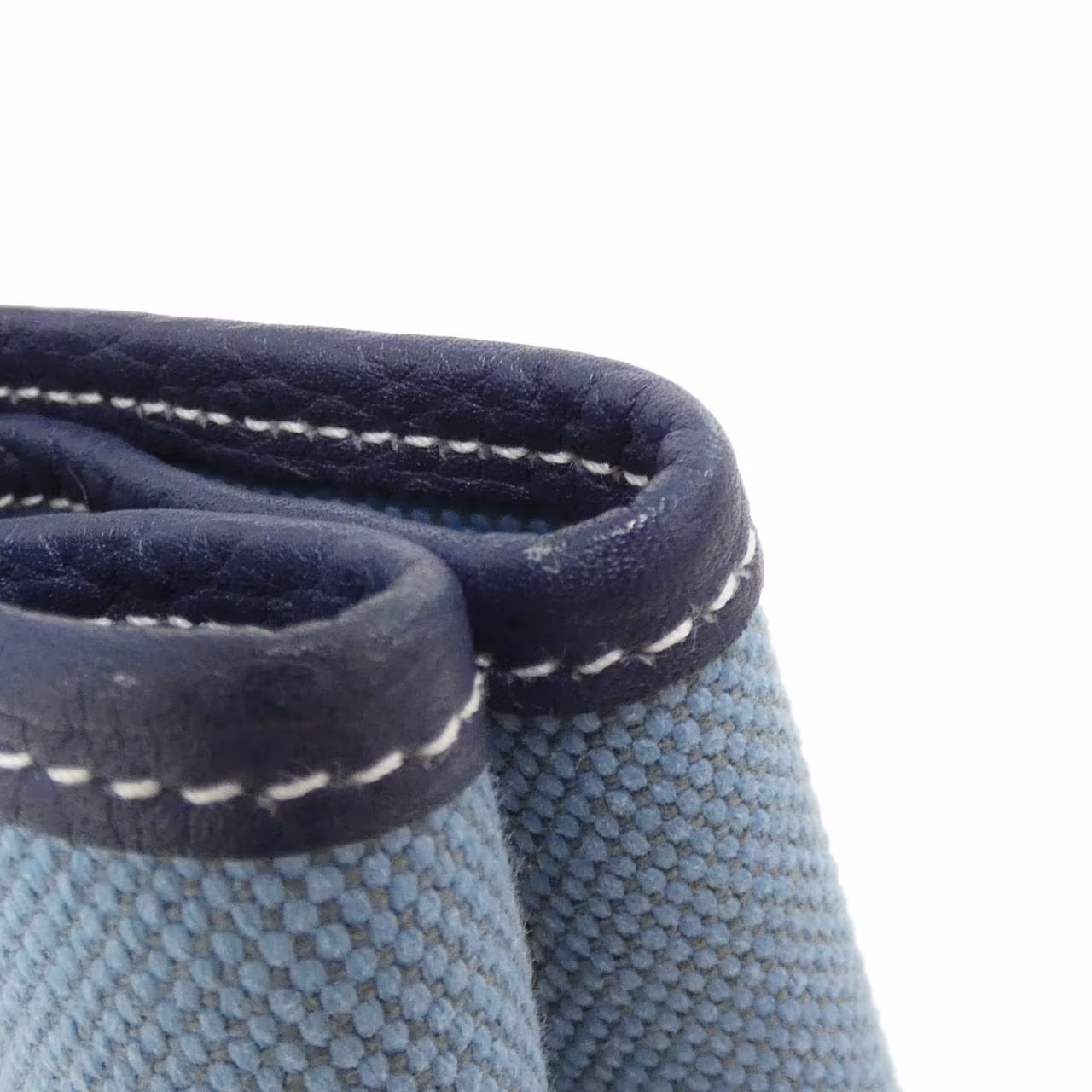 Open-top tote with twin rolled handles shown against a plain background.