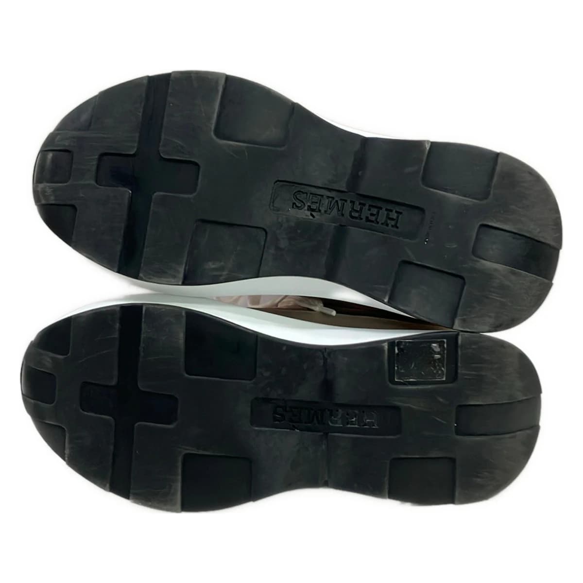 Pair of low-top women's trainers shown side on.