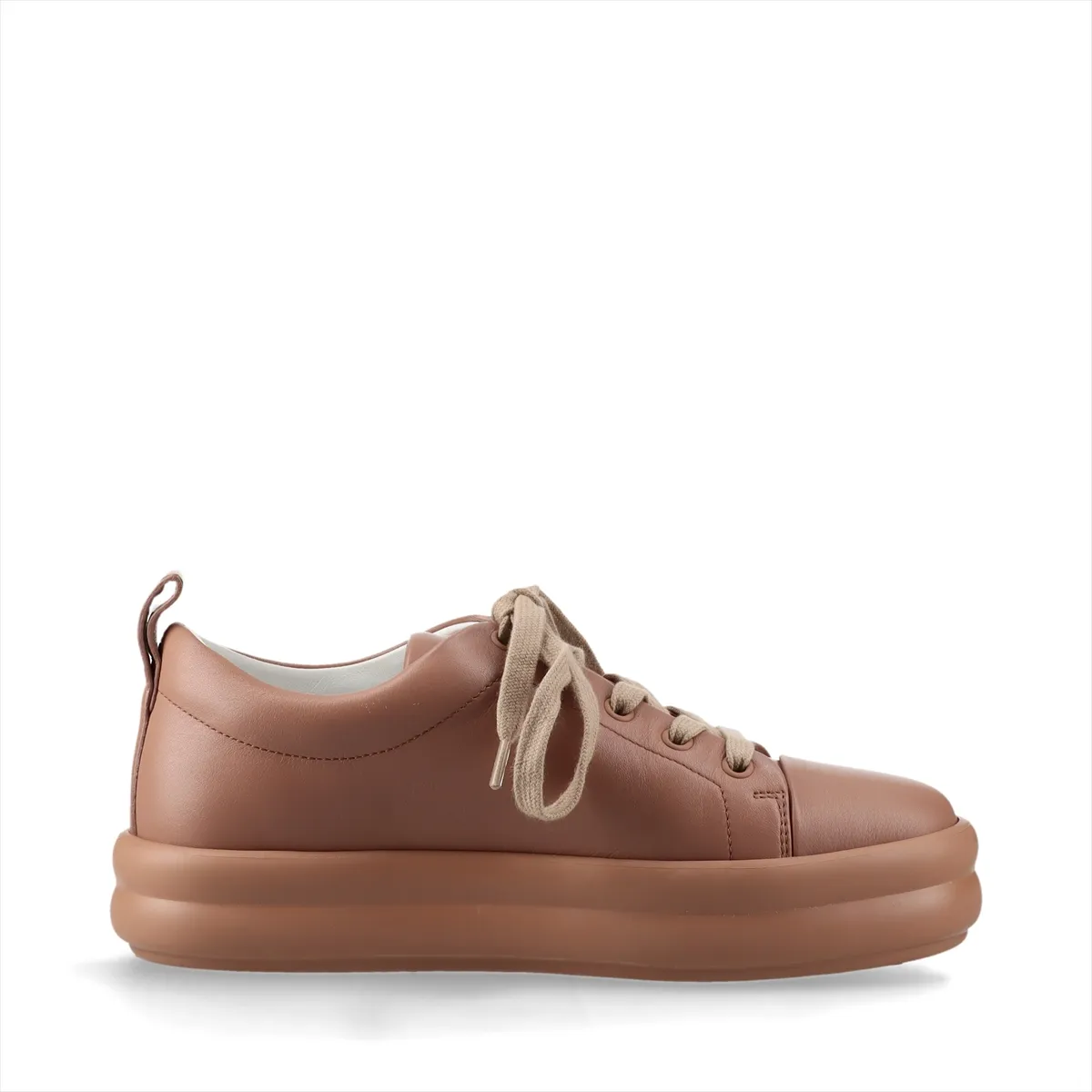 Low-top leather sneakers in a soft pink-brown tone with white soles.