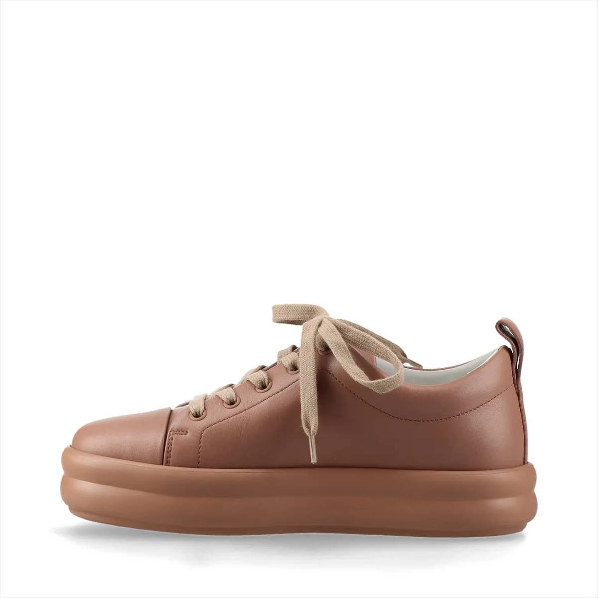Low-top leather sneakers in a soft pink-brown tone with white soles.
