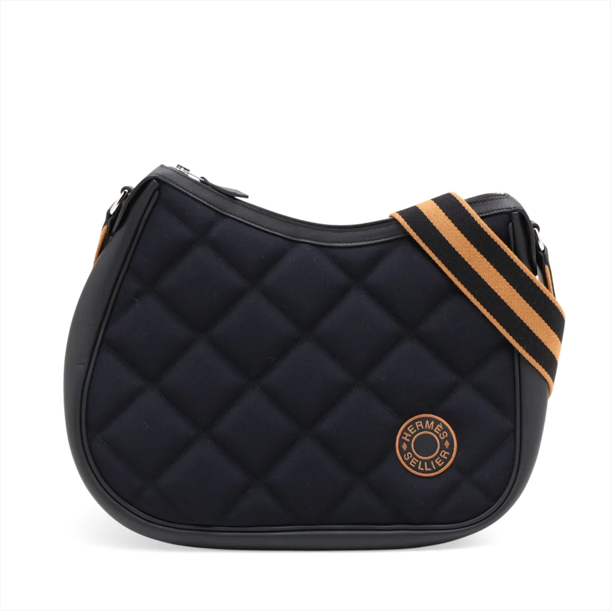 Navy canvas bag with black leather trim and silver-tone fittings.