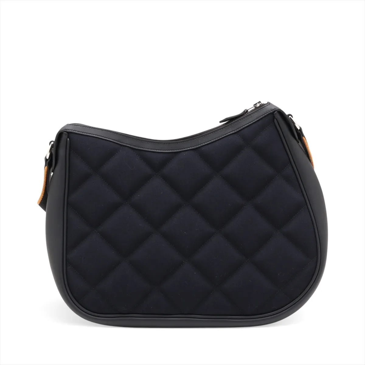 Navy canvas bag with black leather trim and silver-tone fittings.