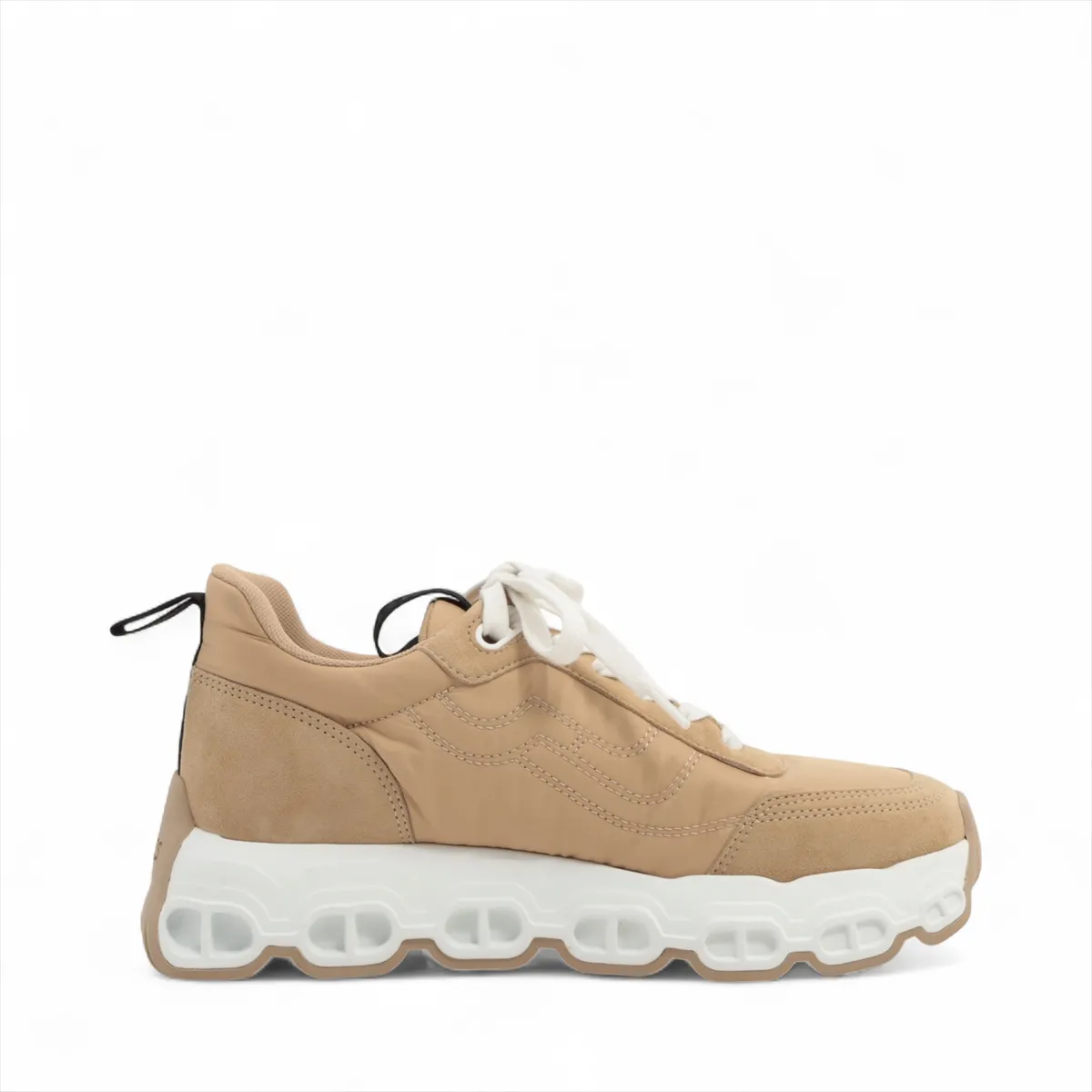 Beige suede and fabric trainer with a chunky white platform sole and chain-link motif