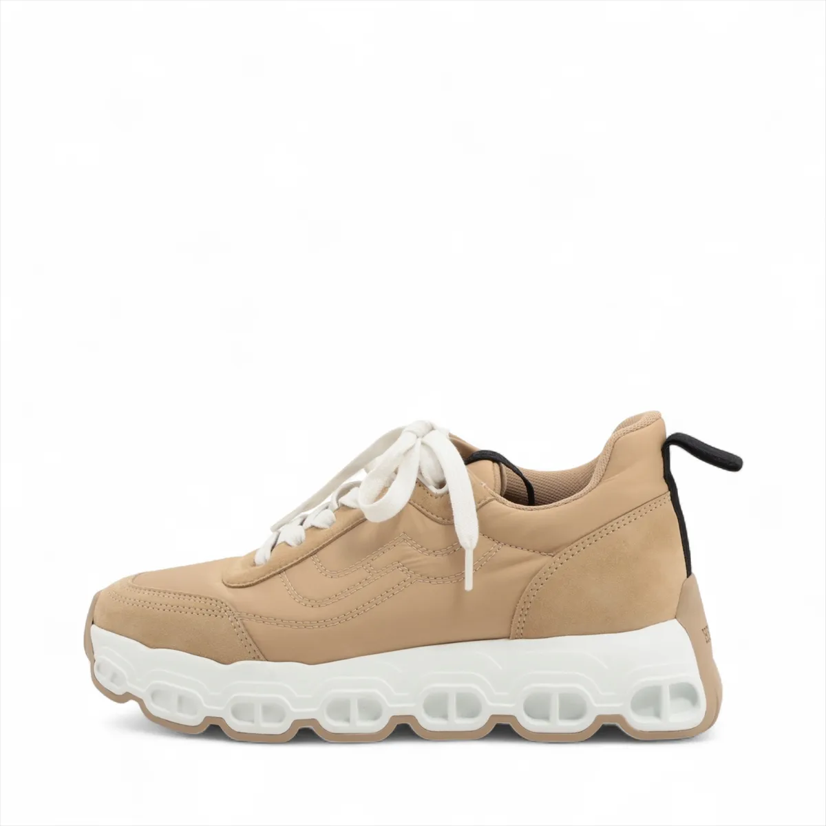 Beige suede and fabric trainer with a chunky white platform sole and chain-link motif