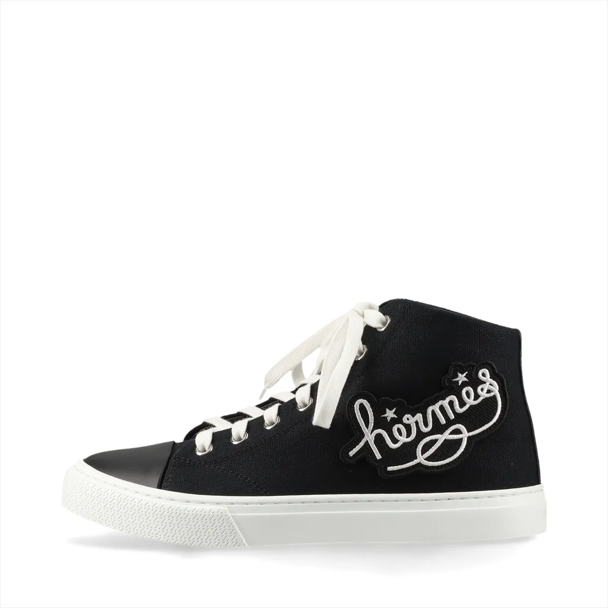 Black canvas high-top sneakers with leather trim and a woven logo patch