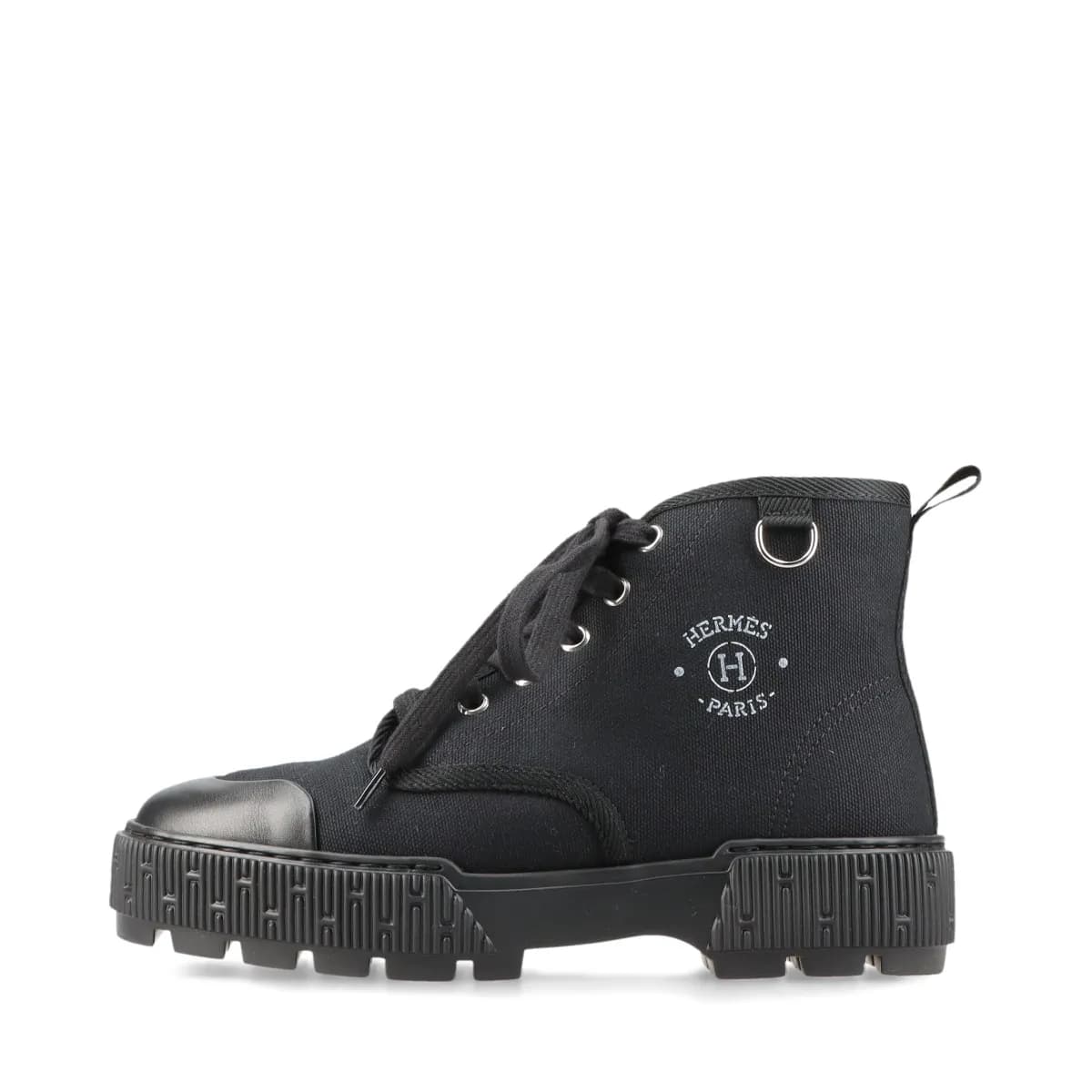 Black canvas and leather lace-up high-top footwear with a thick platform sole, shown from the side