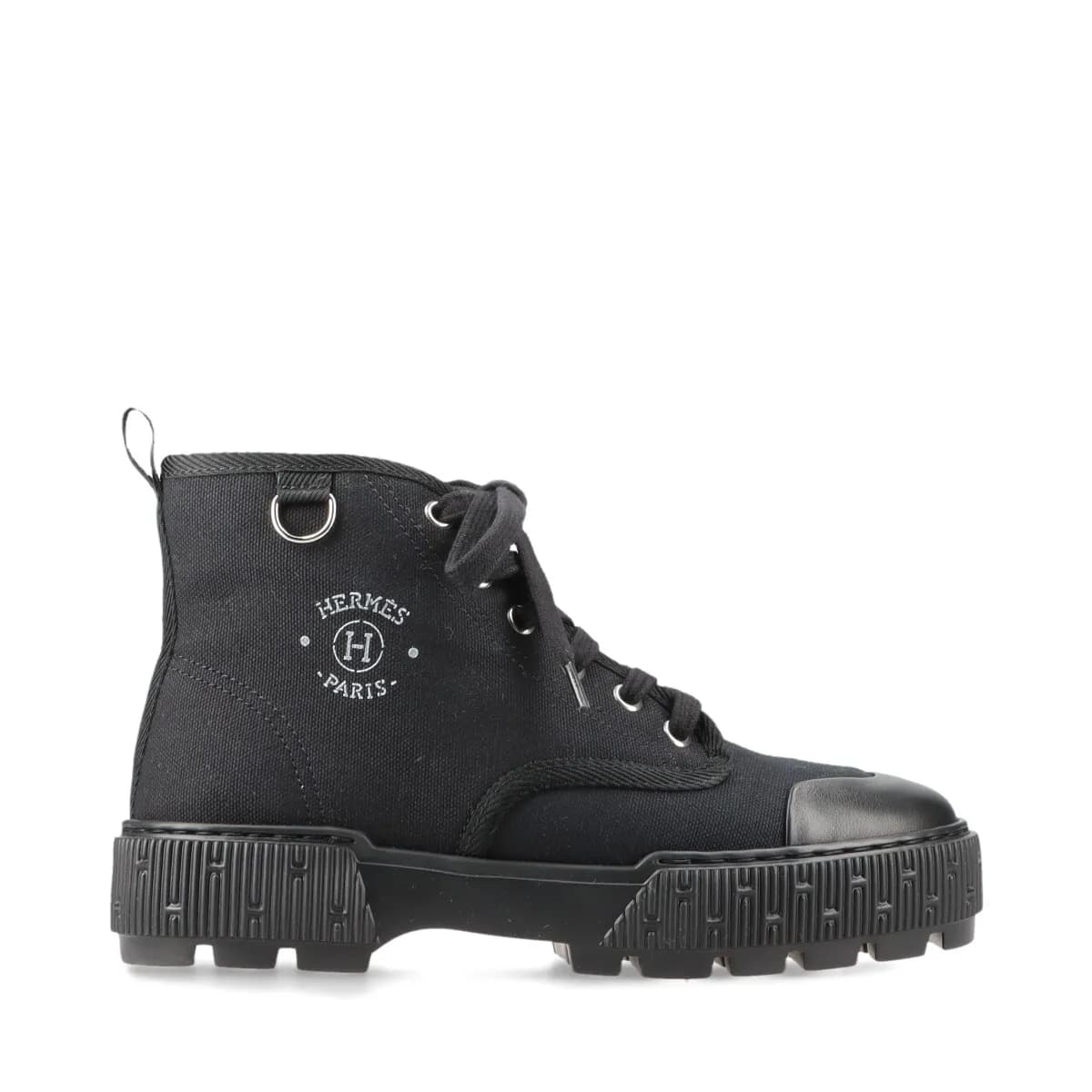 Black canvas and leather lace-up high-top footwear with a thick platform sole, shown from the side