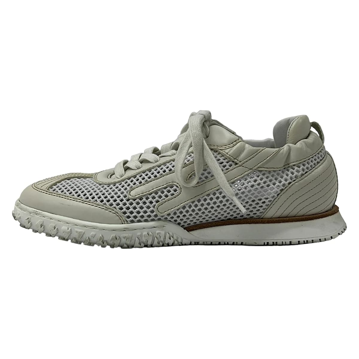 White mesh low-top shoe with leather panels, shown on a plain background.