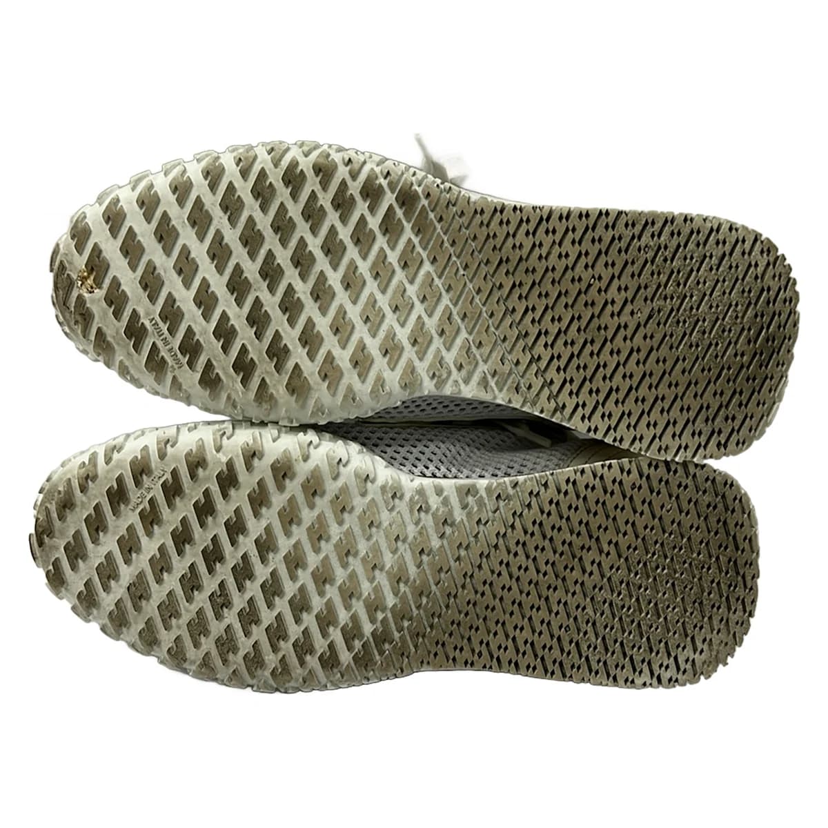 White mesh low-top shoe with leather panels, shown on a plain background.