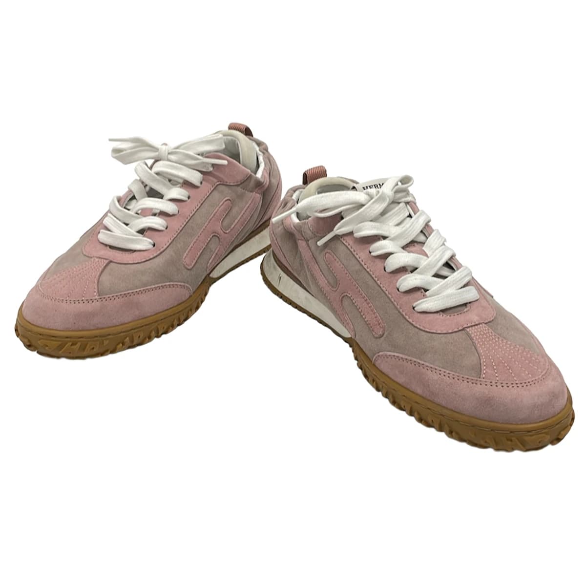 Pair of low-top lace-up shoes photographed side on against a plain background.