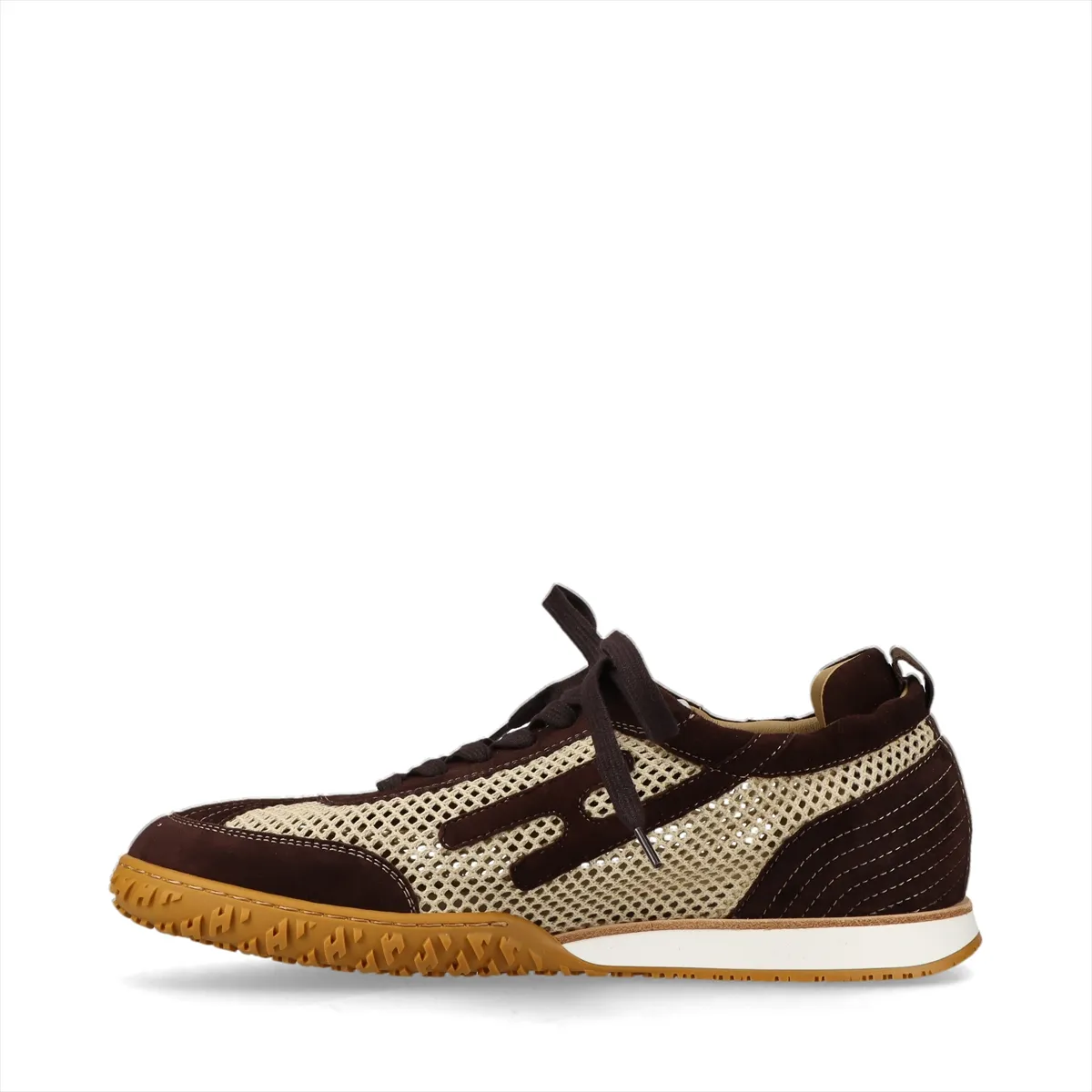 Low-top mesh sneakers in beige with brown suede overlays, side view on a white background.