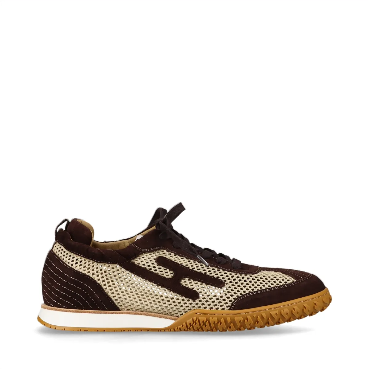 Low-top mesh sneakers in beige with brown suede overlays, side view on a white background.
