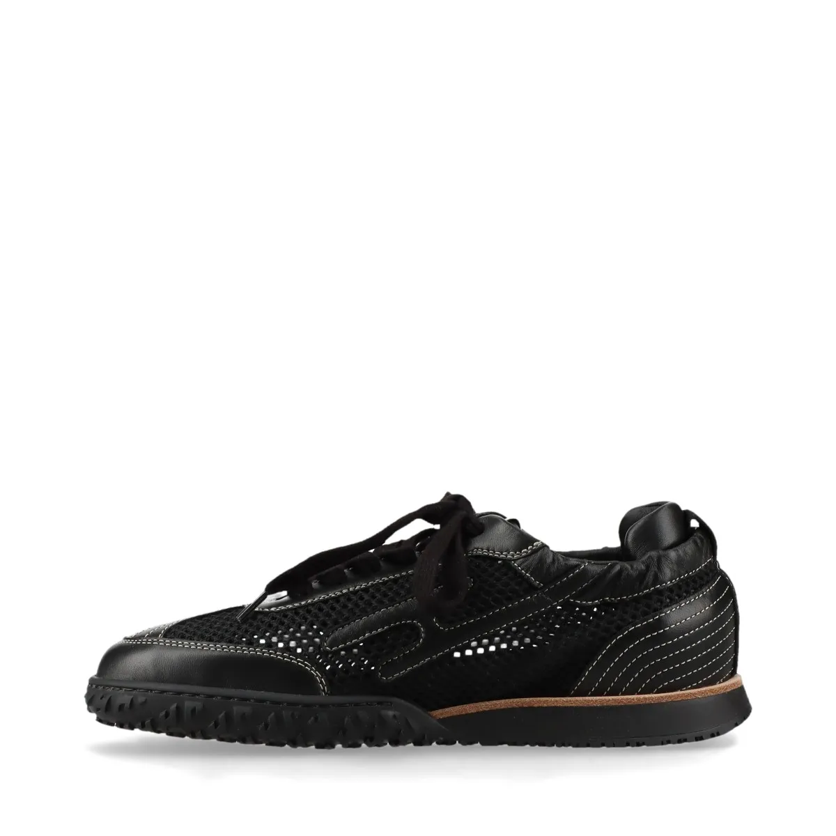 Black low-top sneakers with mesh panels and white soles.