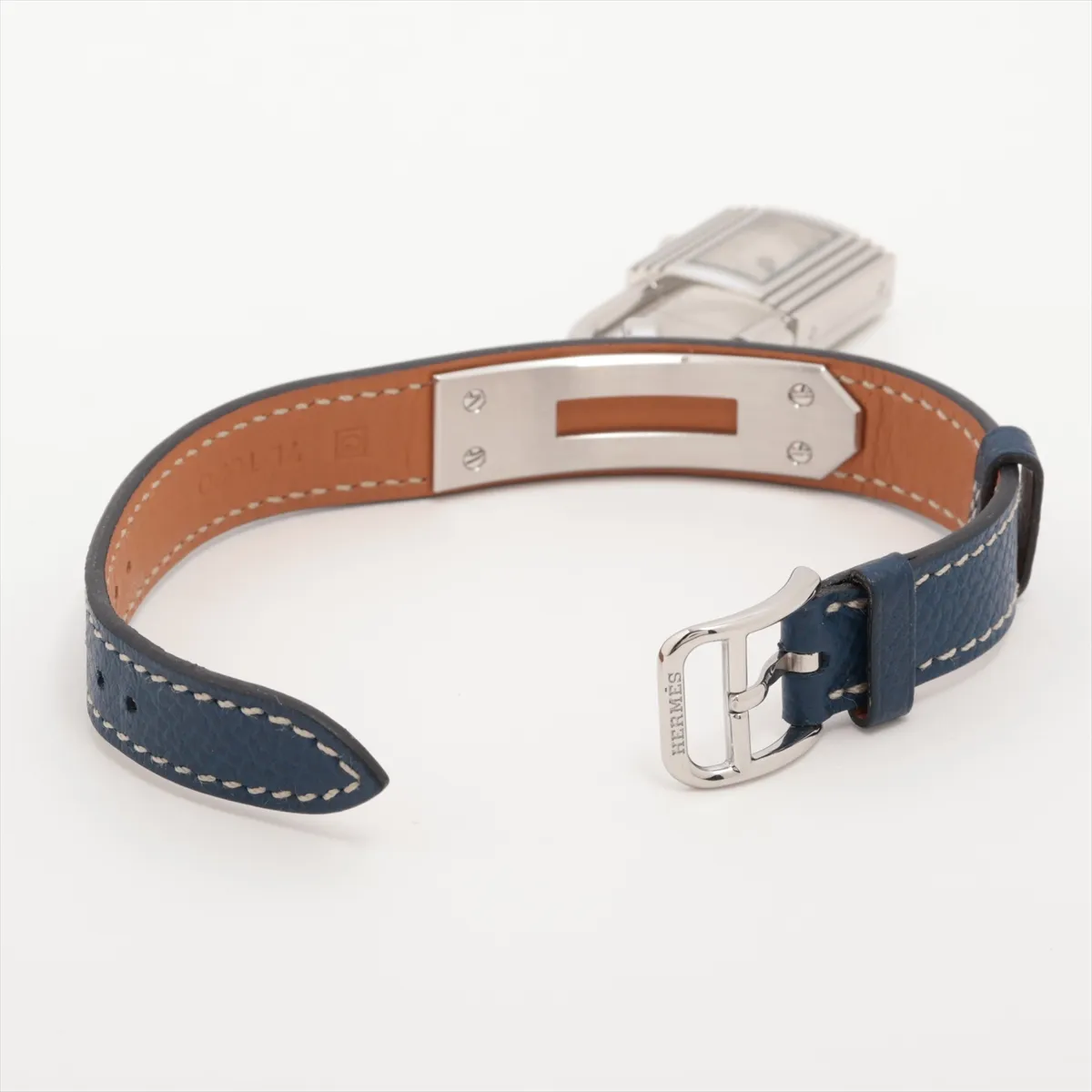 Padlock-shaped steel watch with silver dial on a leather strap.