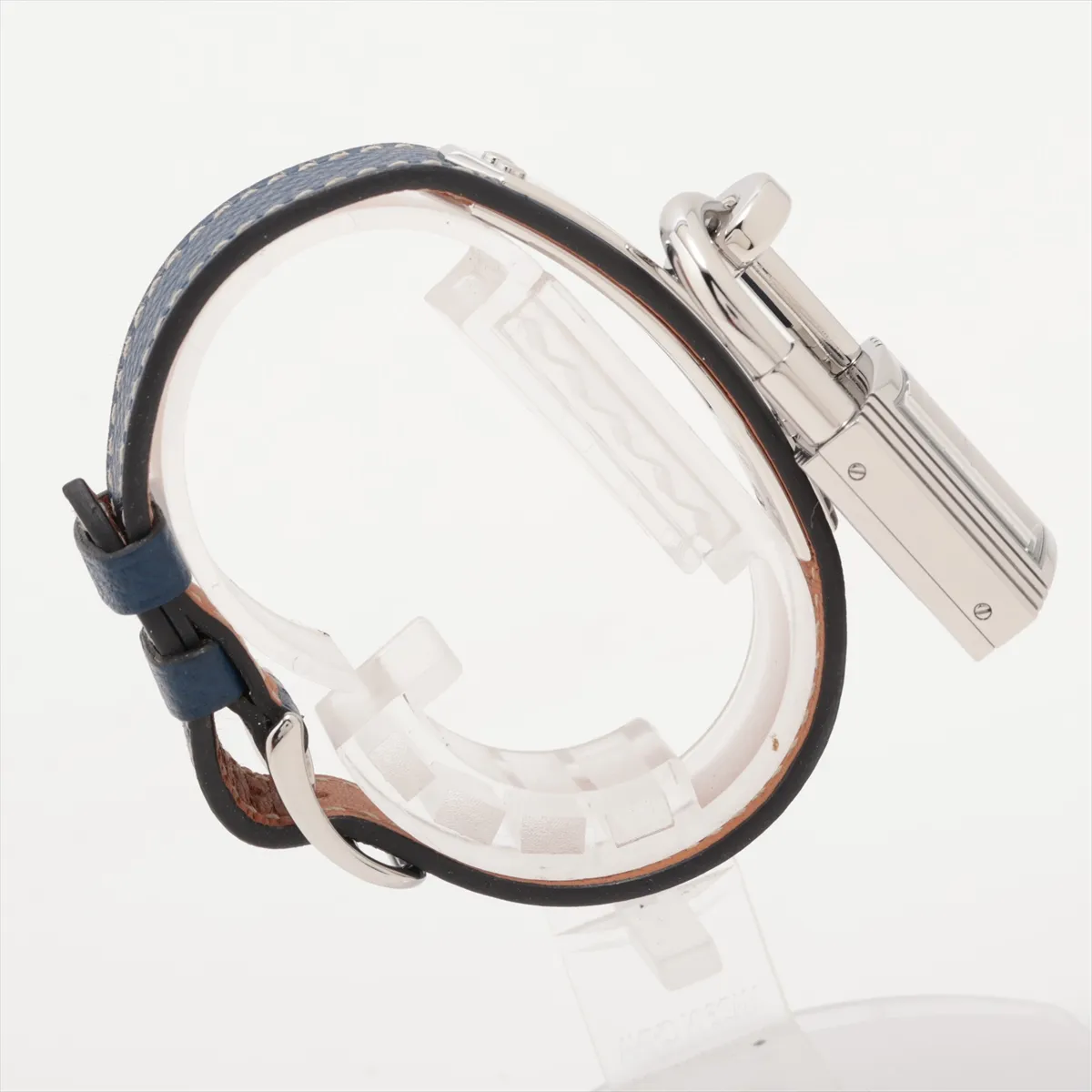 Padlock-shaped steel watch with silver dial on a leather strap.
