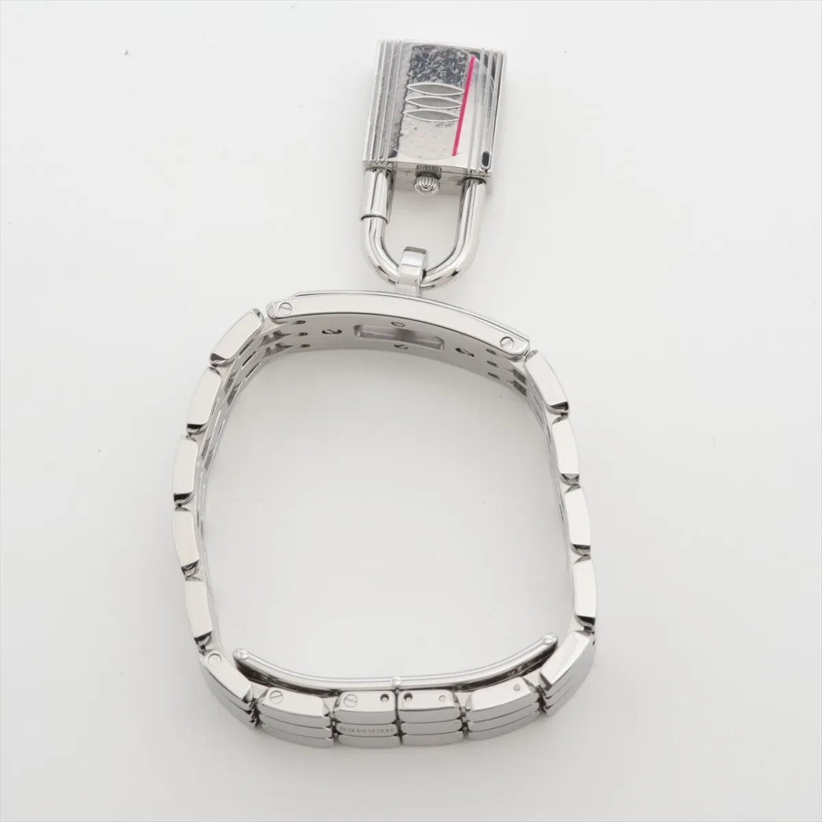 Small rectangular watch with white dial on a steel strap, shown on a plain background.