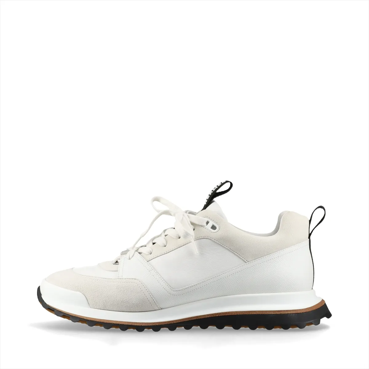 White low-top sneakers with mesh panels and black trim on a chunky white sole.